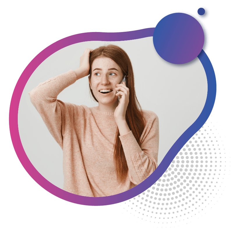 A woman with long hair wearing a soft pink sweater holds her head with one hand while talking on a phone, symbolizing the convenience and connectivity of eSIM for modern living in Australia.